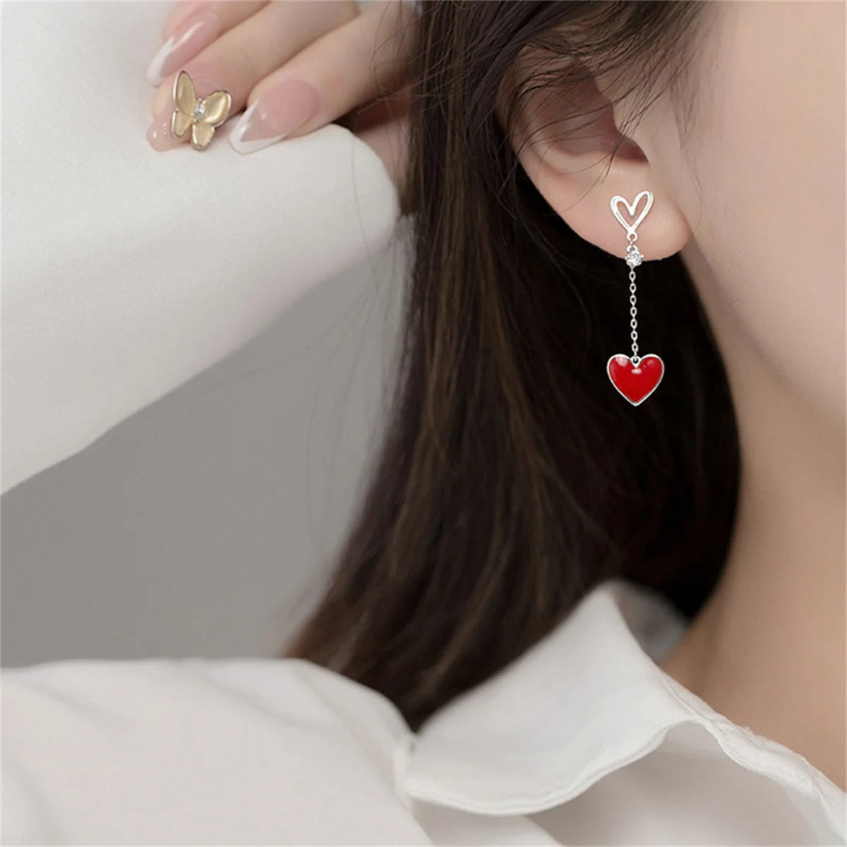 Asymmetric Hollow Black Heart Dangle Earrings.