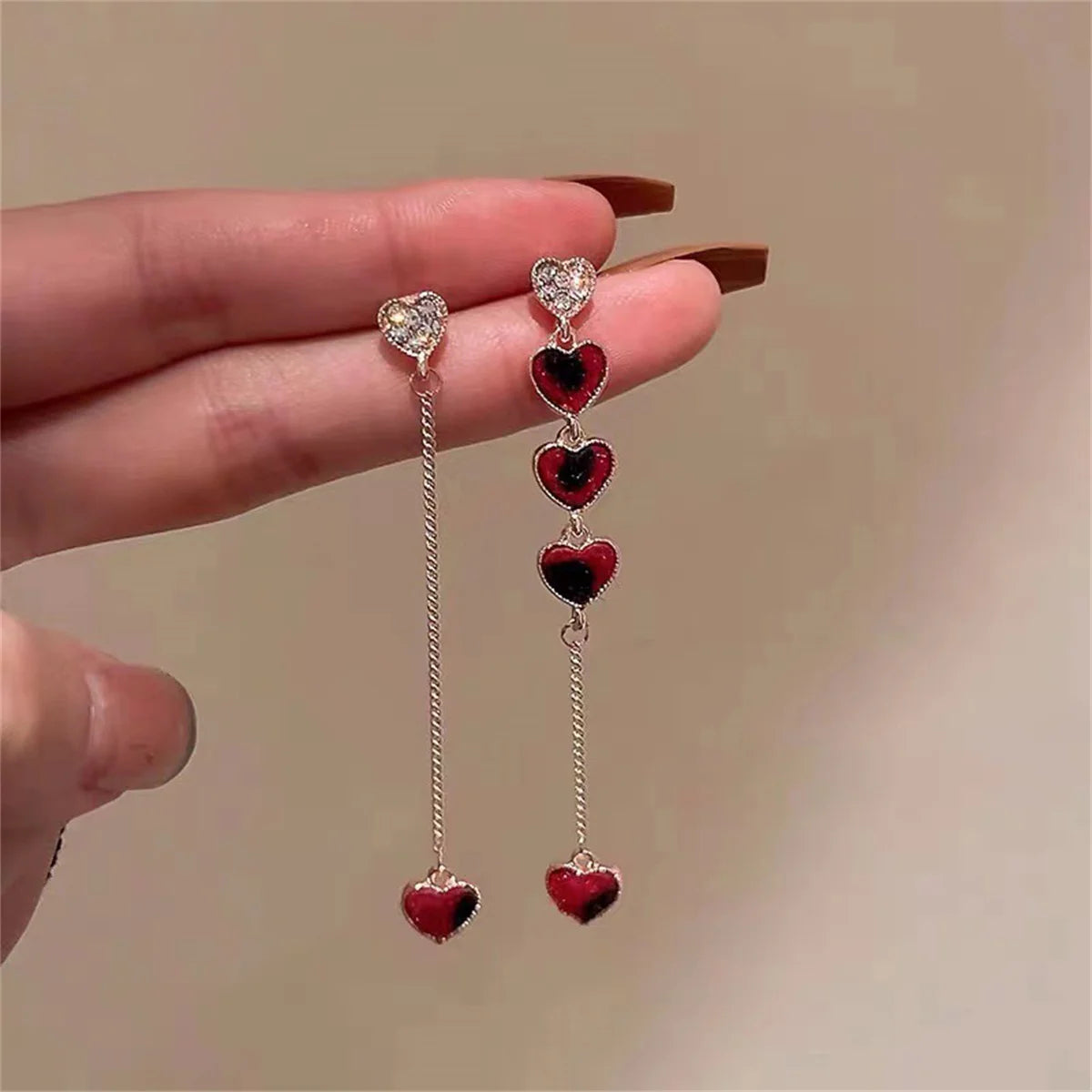 Asymmetric Hollow Black Heart Dangle Earrings.