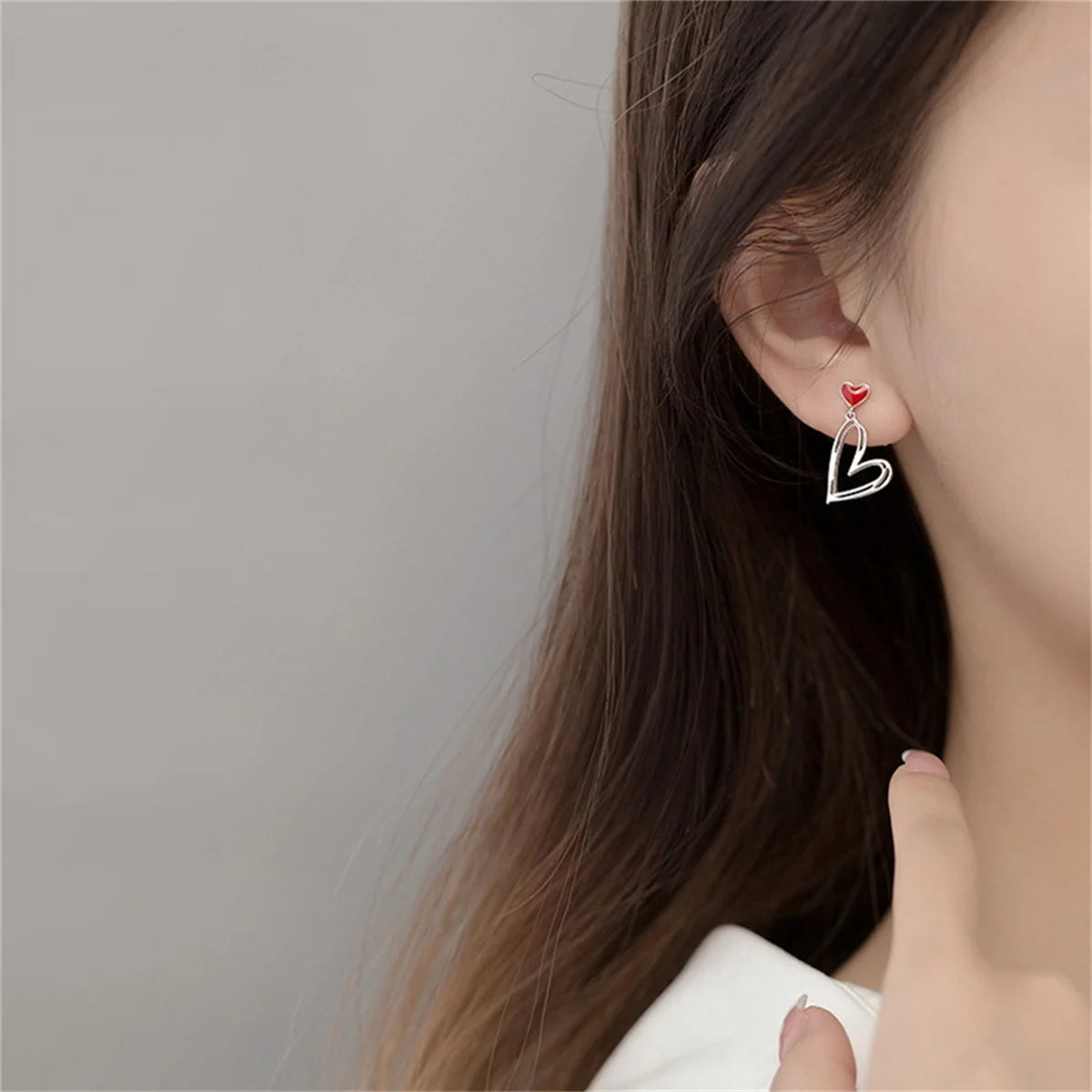 Asymmetric Hollow Black Heart Dangle Earrings.